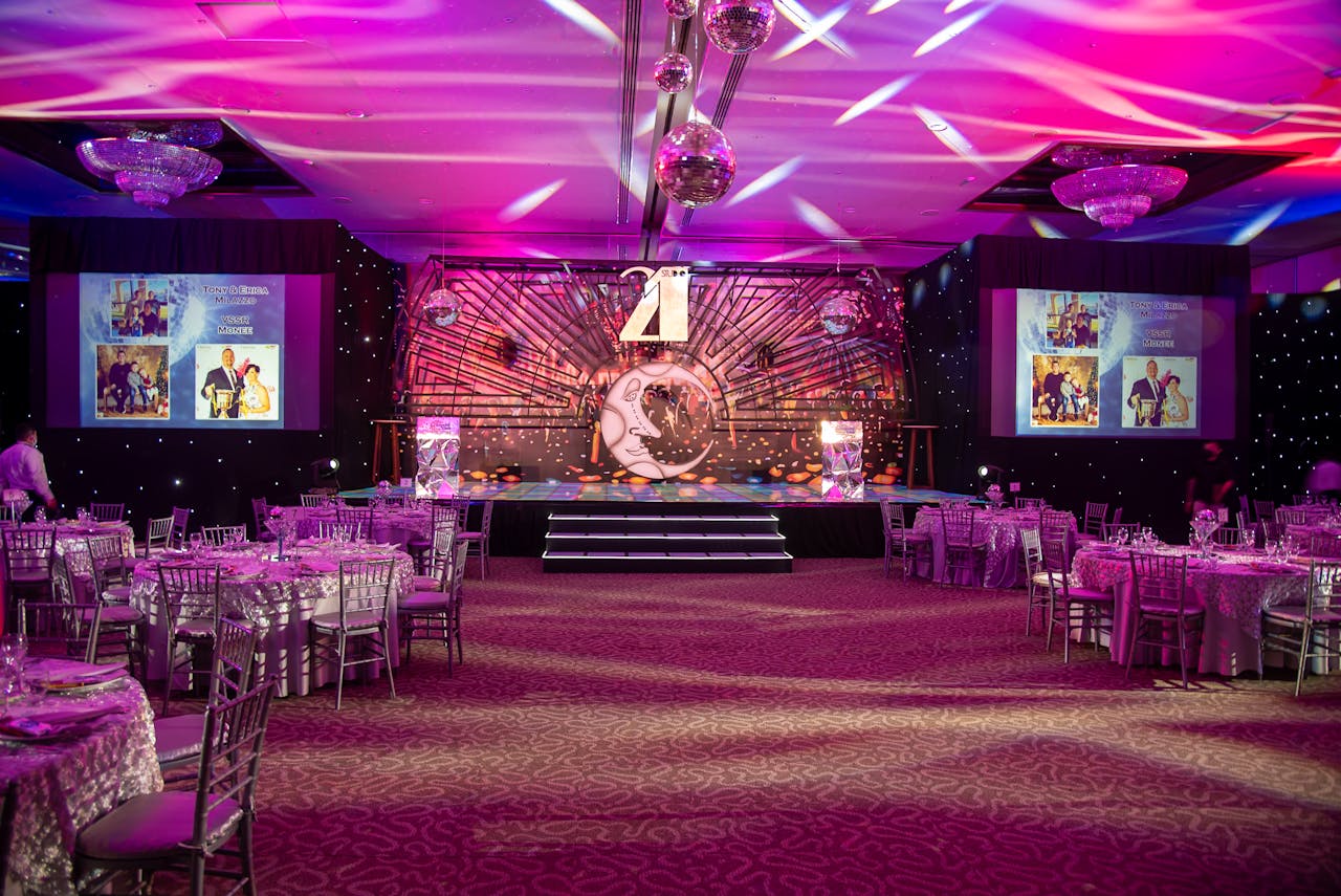 about-02 Vibrant event hall set up for a themed dinner with elegant decorations and lighting.